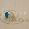 Bague argentée et partie centrale bleue et blanche