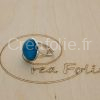 Bague argentée et partie centrale bleue et blanche